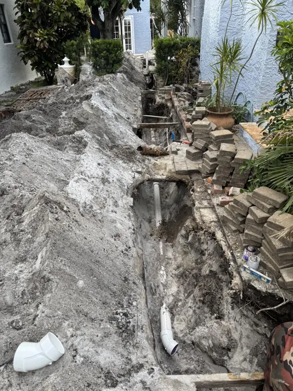 Sewer line replacement, during: The trench along the house