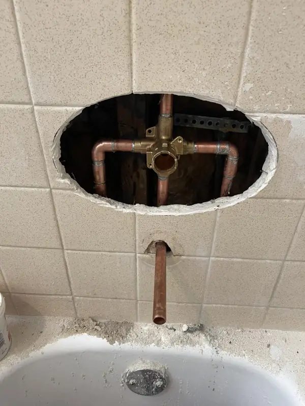 Tub and shower valve replacement, during: New valve roughed in